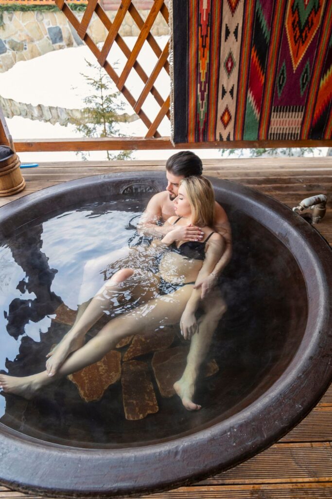 couple soaking in hot springs