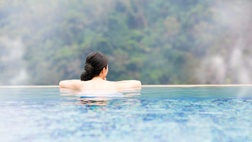 woman looking out from hot springs