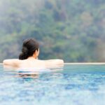 woman looking out from hot springs