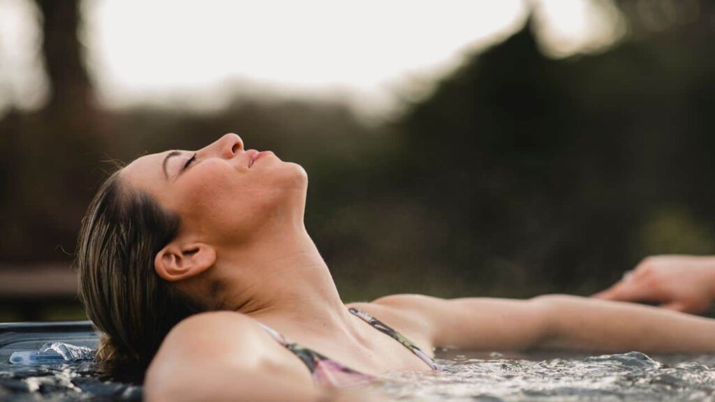 woman soaking in hot tub