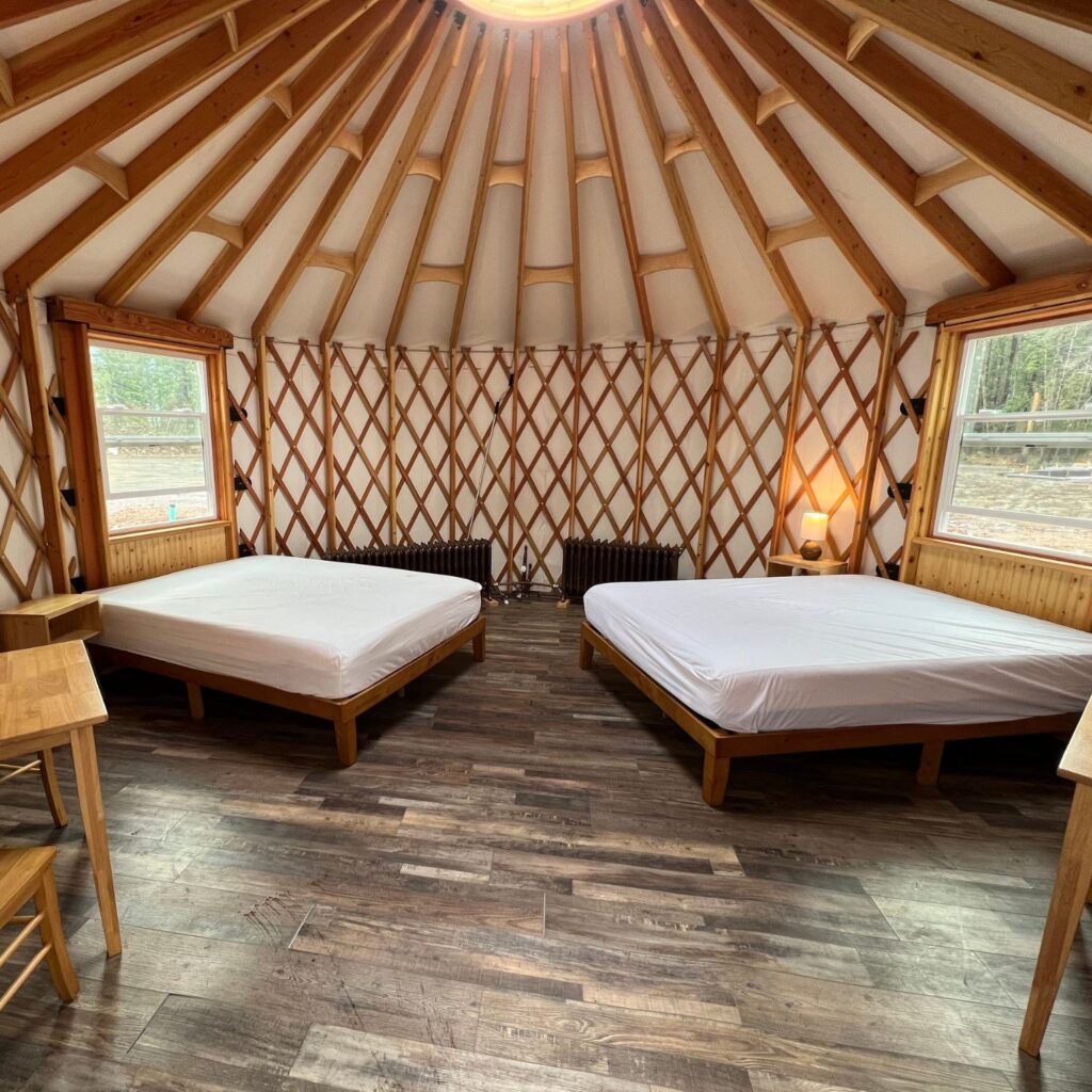 two beds inside a yurt