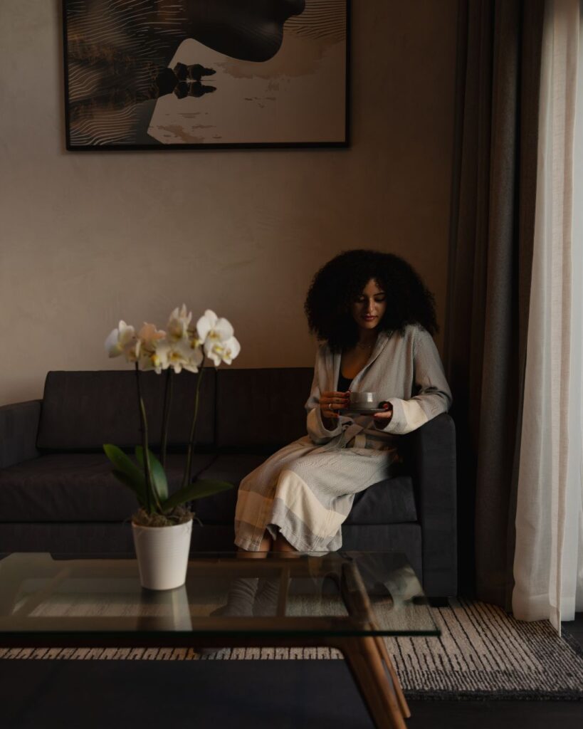 woman sitting in hotel room