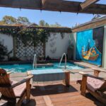 two chairs looking at an outdoor saltwater soaking pool