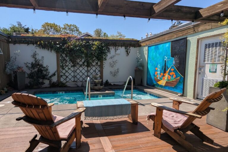 two chairs looking at an outdoor saltwater soaking pool